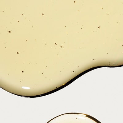 beige liquid w/ small bubbles